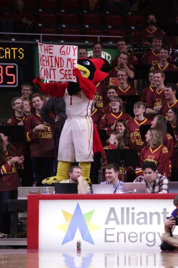 Iowa States mascot, Cy the Cyclone, entertains the crowd with his sideline antics at the Womens basketball game on Saturday.
