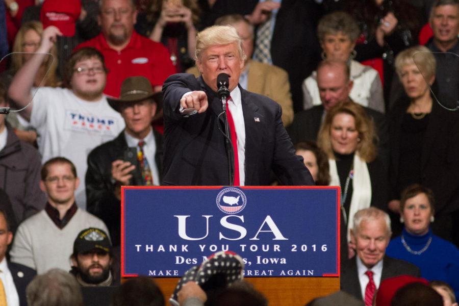 Then-President-elect Donald Trump points at the crowd during a rally as part of his USA Thank You Tour in Des Moines during the evening of Dec. 8, 2016. Trump spoke about the general election, how he would repeal Obamacare, bring jobs back to the U.S. and reform care for veterans. 