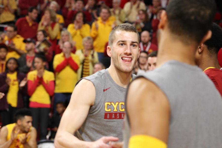 Iowa State senior Matt Thomas slaps hands with teammate Nick Weiler-Babb during player introductions before their game against Kansas State.