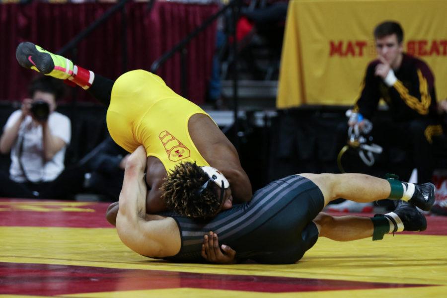 Iowa State redshirt freshman Markus Simmons (top) wrestles Arizona State. Simmons would go on to defeat Rico 14-4 by fall. 