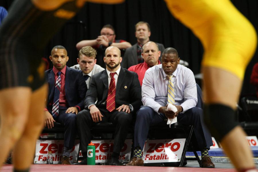 The Iowa State wrestling coaches watch the match between Patrick Downey and Arizona States Connor Small Jan. 6. 