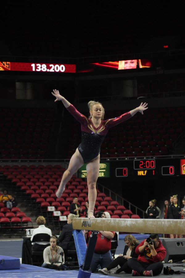 Haylee Young performs her beam routine on Jan. 13 in Hilton Coliseum during Iowa State gymnastics tri-meet on Jan. 13. Iowa State won the tri-meet against Towson and UW-Oskosh with a score of 194.275.