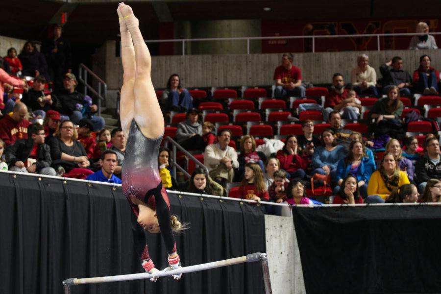 Iowa State junior Haylee Young performs her uneven bars routine, scoring a 9.8. The Cyclones hosted Arizona State at Hilton Coliseum for simultaneous gymnastics and wrestling meets, dubbed Beauty and the Beast. The gymnastics team defeated the Sun Devils 193.850-191.8, while the wrestling team lost 25-14. 