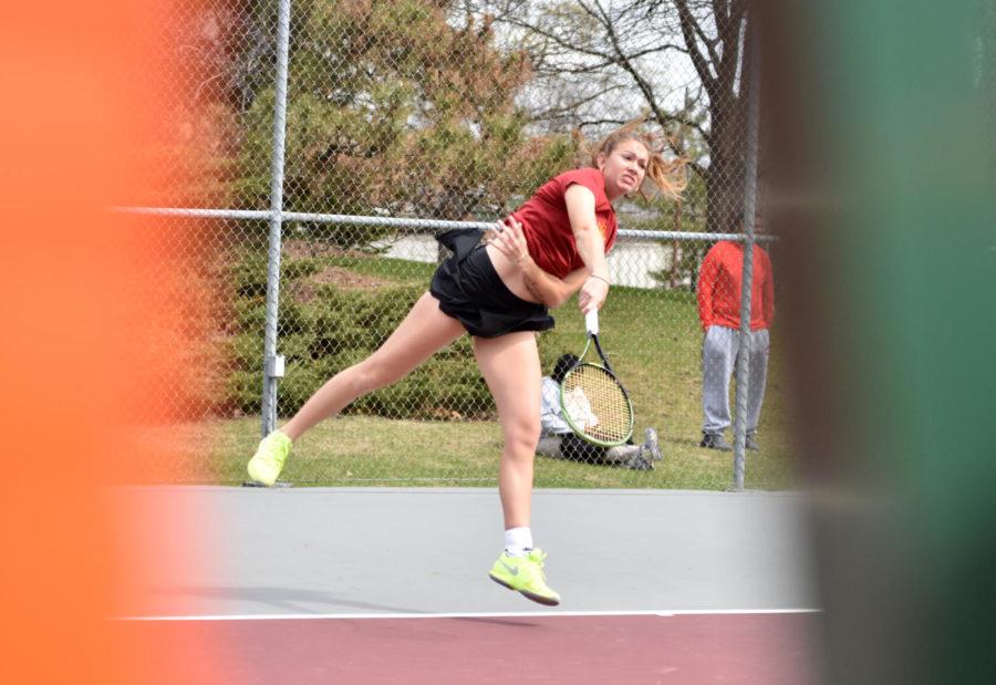Iowa State junior Samantha Budai hits the ball at the Kansas match on April 10 at the Forker Tennis Courts.