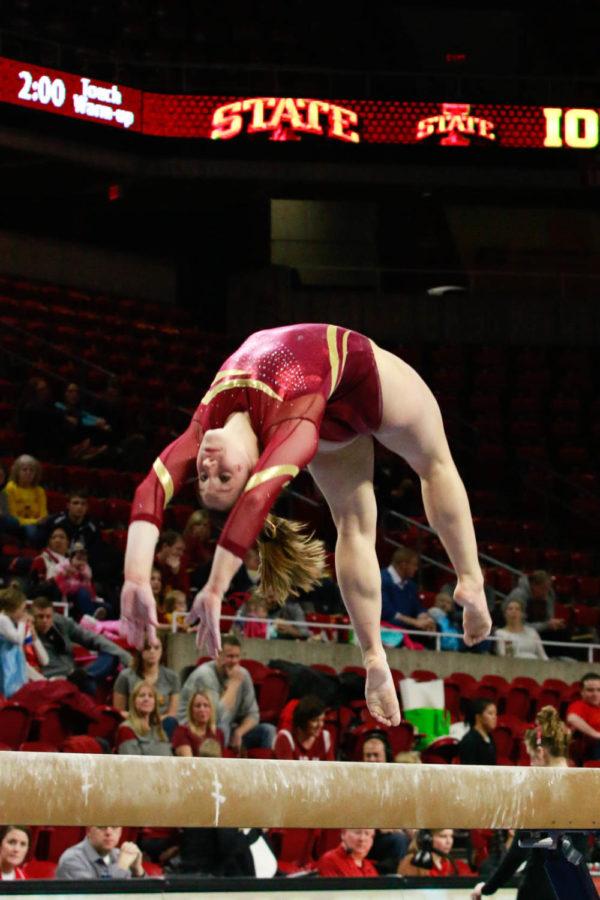 A Iowa State gymnast performs on the balance beam during their tri-meet against Southeast Missouri and Centenary. The Cyclones won the meet with a score of 195.775. 