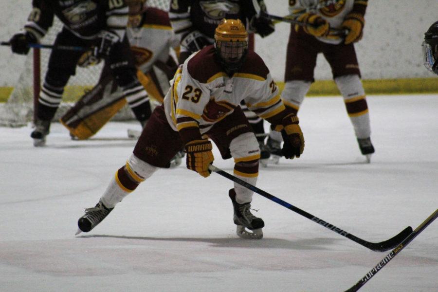 Sophomore forward Jon Severson skates to the puck during the game against Robert Morris on Jan. 27. Severson would later score the last goal, making the score 3-1 in the third period.