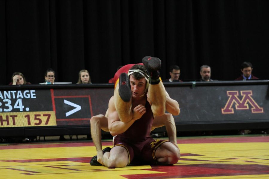 Colston DiBlasi wrestles Minnesota's Jake Short on Feb. 19 in Hilton Coliseum. Short came up with a 9-1 major decision over DiBlasi. Minnesota defeated Iowa State 40-7 in their final meet at home this season.