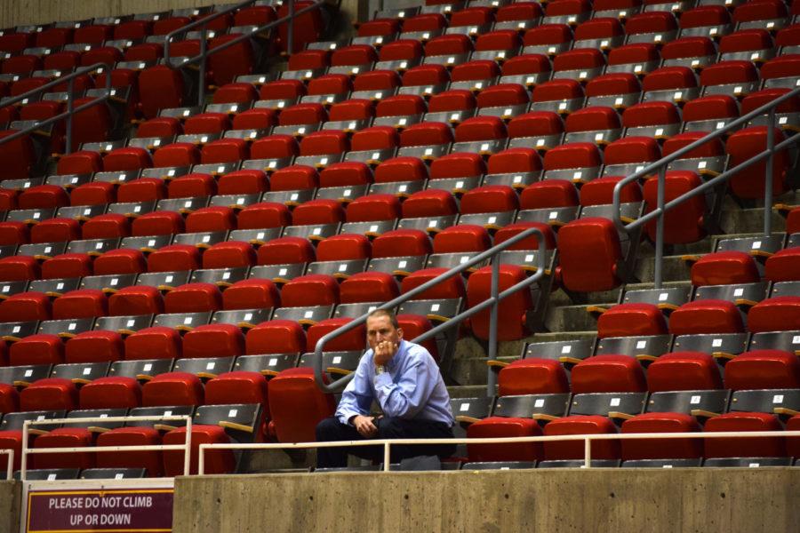 Iowa State Athletic Director Jamie Pollard sits alone inside Hilton Coliseum before a volleyball practice in September 2015.