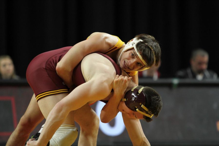 Gabe Moreno wrestles Minnesotas Ben Brancale on Feb. 19. Moreno goes out with an 8-0 major decision and 4:15 of riding time on Senior Day. Minnesota defeated Iowa State, 40-7.