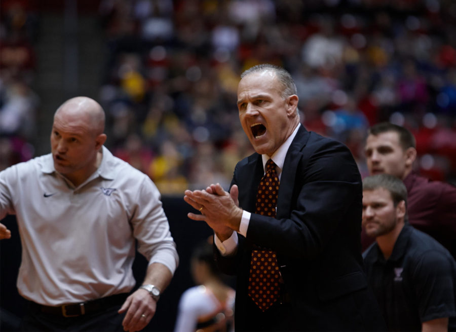 Virginia Tech head coach Kevin Dresser gets emotional as the meet turns in Iowa States favor on Jan. 18, 2015. Dresser has accepted an offer to become Iowa States next head coach, a source told the Daily. 