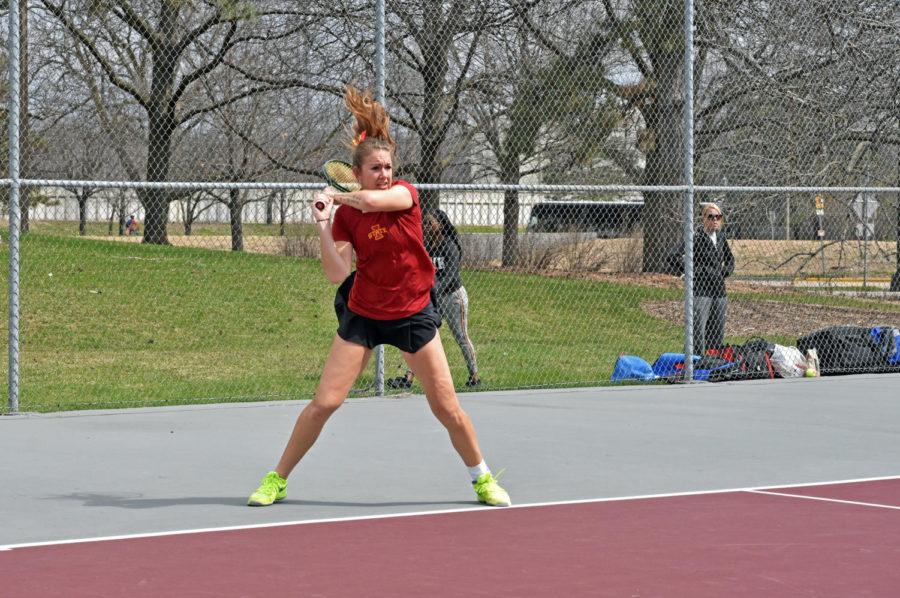 Junior Samantha Budai prepares to hit the ball in the singles tennis match against Kansas on April 10. ISU fell 4-2. The Cyclones will face Baylor and Texas next week. Budai went 16-17 in singles during her sophomore year.