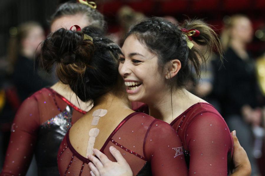 Iowa State freshman Casandra Diaz smiles after finishing her beam routine during the Cyclones' final home meet of the season Feb. 17. 