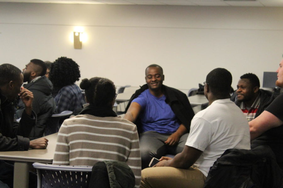 Students discuss questions regarding to the divide between Africans and African Americans in Carver Hall on Feb 24. At the event, students were split up into small groups to talk about various questions presented to them. 