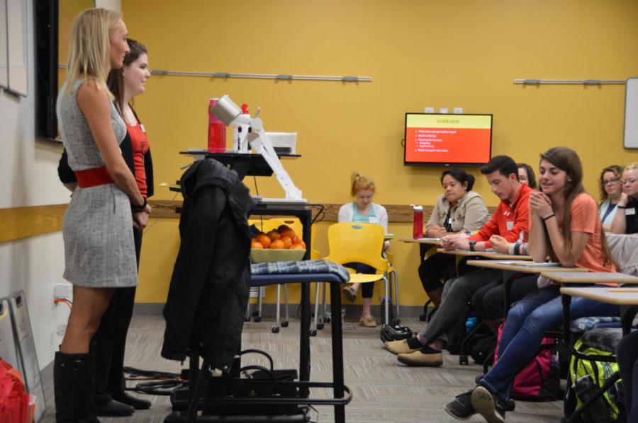 Iowa State dietetic interns Courtney Smith and Christina Boehme give a presentation on healthy eating during the first part of the Culinary Boot Camp on Feb. 27. The second part of the Culinary Boot Camp will take place next Mon. March 6, at MacKay Hall. 