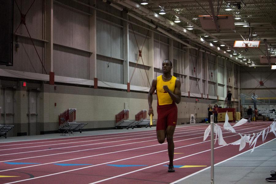 Roshan Roomes competes in the third leg of the 400-meter relay during the Iowa State Classic on February 11 at Lied Recreational Center.