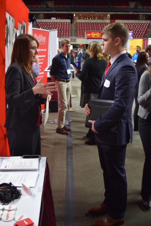 Brady+Claypool%2C+sophomore+in+supply+chain+management%2C+speaks+to+a+recruiter+at+one+of+the+170+booths+at+the+Business%2C+Industry+and+Technology+Career+Fair.%C2%A0The+fair+was+February+8%2C+from+noon+to+6+p.m.+in+Hilton+Coliseum%C2%A0