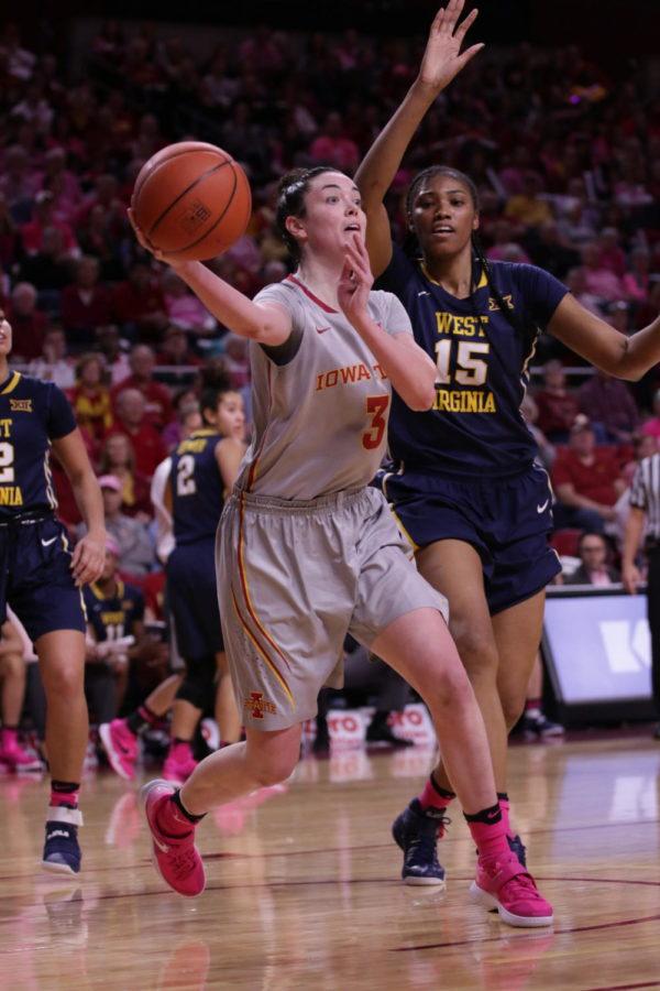 Iowa State junior, Emily Durr, rifles a cross court baseline pass into the waiting arms of Jada Buckley versus West Virginias defense on Saturday afternoon. Durr finished with a career-high nine rebounds. 