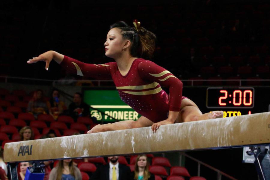 Sophomore Sydney Converse performs on the balance beam during the Cyclones tri-meet against Southeast Missouri and Centenary. Iowa State won the meet with a score of 195.775.