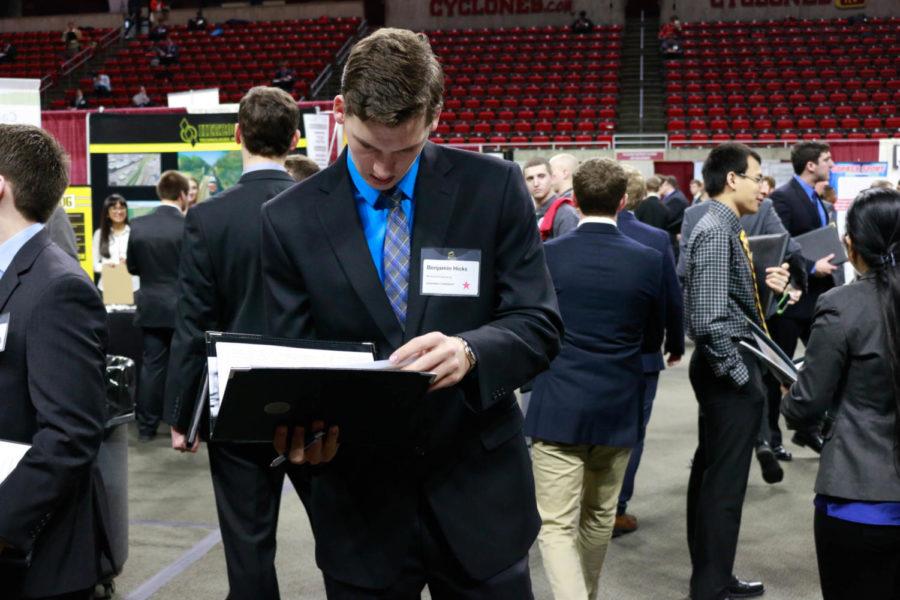 A prospective intern looks over his resume before talking with companies at the Engineering Career Fair Feb. 7. The fair was held at Hilton Coliseum and had over 350 employers in attendance. 
