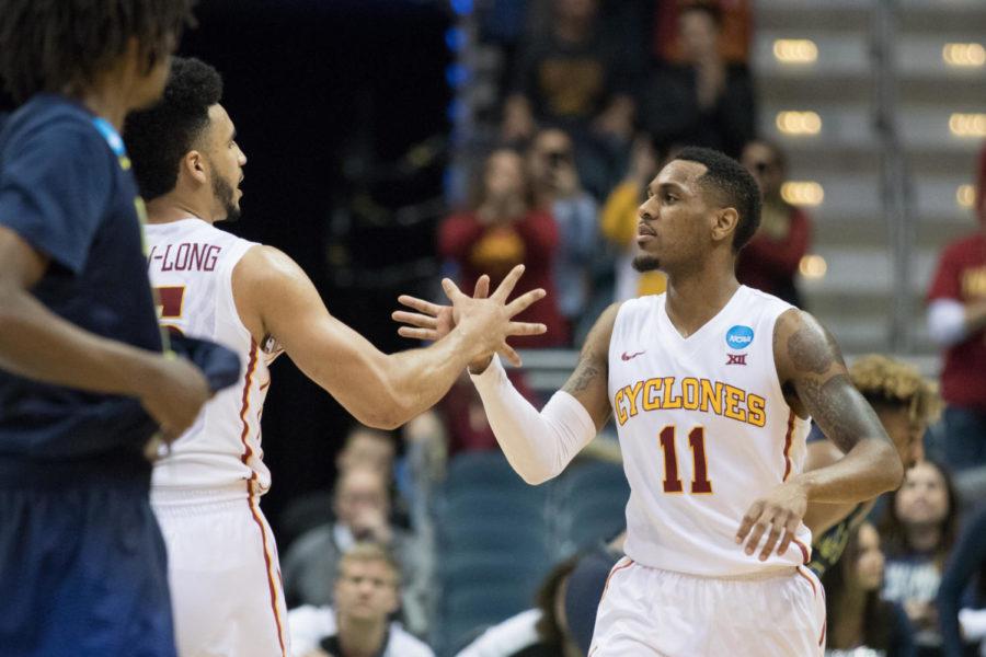 Seniors Naz Mitrou-Long (L) and Monte Morris (R) celebrate at the end of a game against the Nevada Wolf Pack, March 16 in Milwaukee Wisconsin in the first round of the NCAA tournament. The Cyclones won 84-73, and will play Purdue this Saturday in the second round of the tournament.