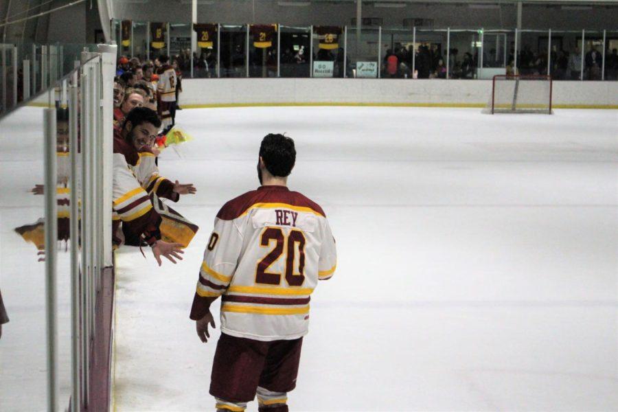 Senior Chase Rey celebrates his four years playing on the Cyclone Hockey team on Mar. 4. His friends and family where there to celebrate.