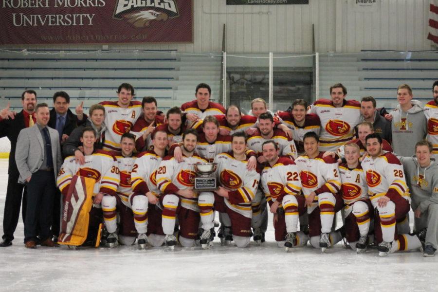 Cyclone+Hockey+and+coaching+staff+pictured+with+the+Central+States%C2%A0Collegiate+Hockey+League+championship+trophy+following+the+5-4+overtime+victory+over+the+Lindenwood+Lions.