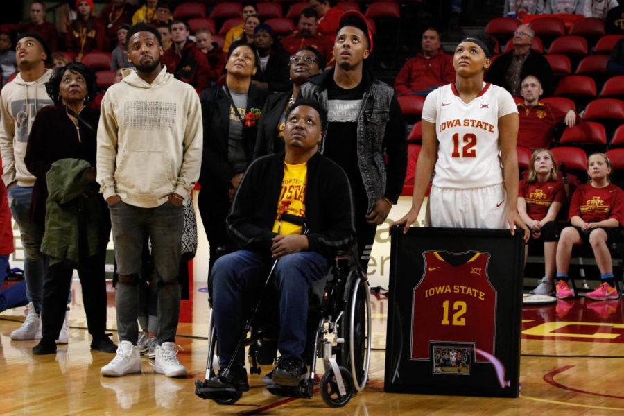 Seanna Johnson and family look up towards the video board as a tribute from her plays for the Cyclone fans. 