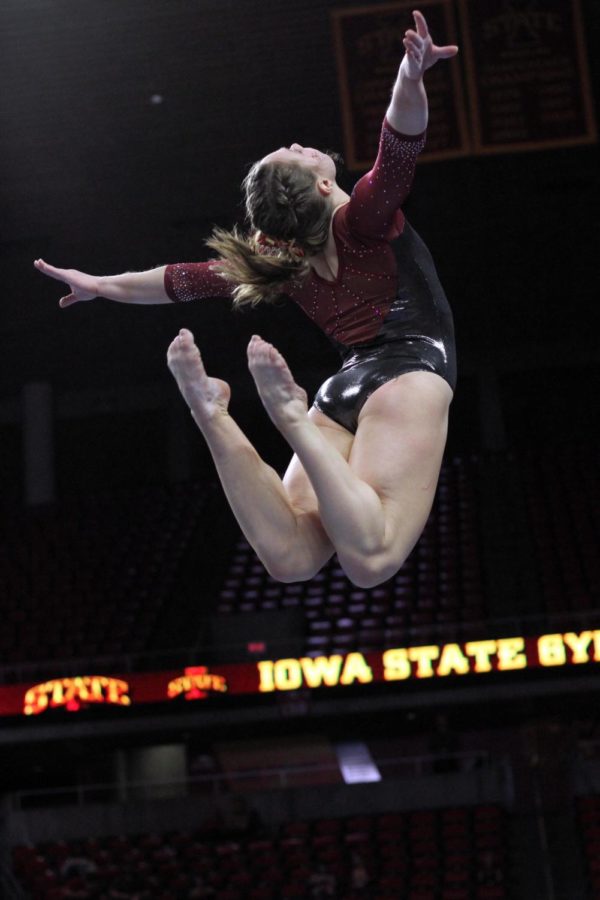 Kelsey Paz jumps during her beam routine. The Cyclones won their tri-meet on Feb. 17 against Illinois State and Gustavus with a score of 195.625.