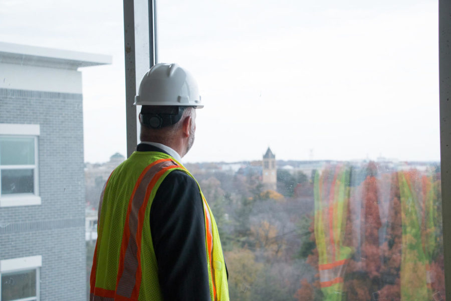 ISU President Steven Leath looks out toward Central Campus from the eighth floor of Geoffroy Hall. Leath served as Iowa State's 15th president for five years before accepting a job at Auburn University. 