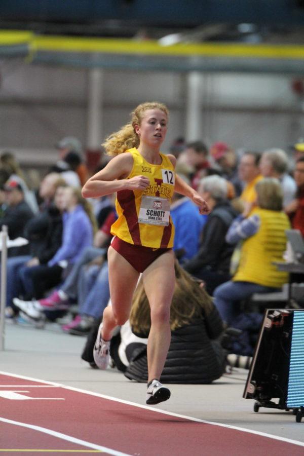 Sophomore Megan Schott runs in the womens 5000-meter Feb 24 during the Big 12 Track and Field meet. Schott came in 16th with a time of 16:57.765.
