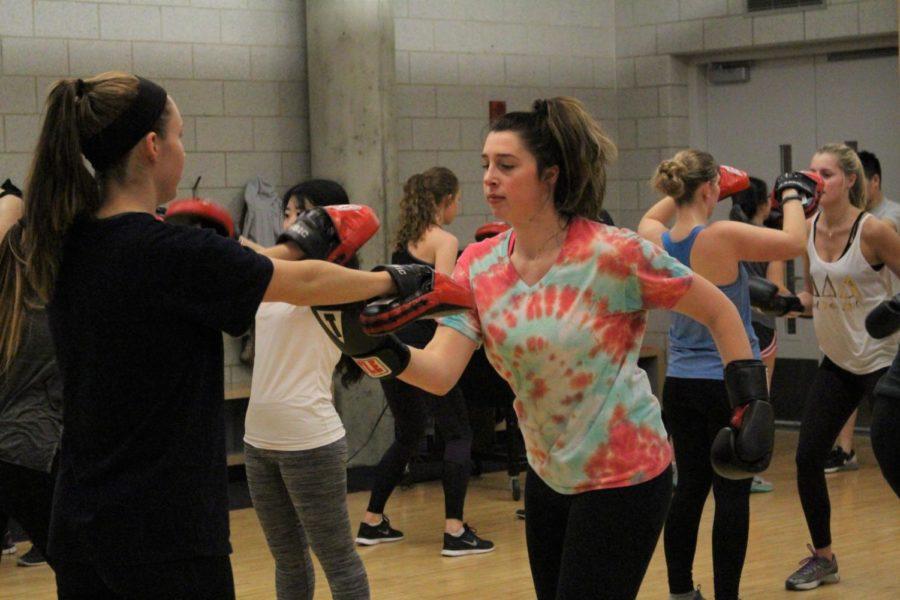 Daily does kickboxing. Reporter Amanda Wymore tries out kickboxing at State Gym on Jan. 19.