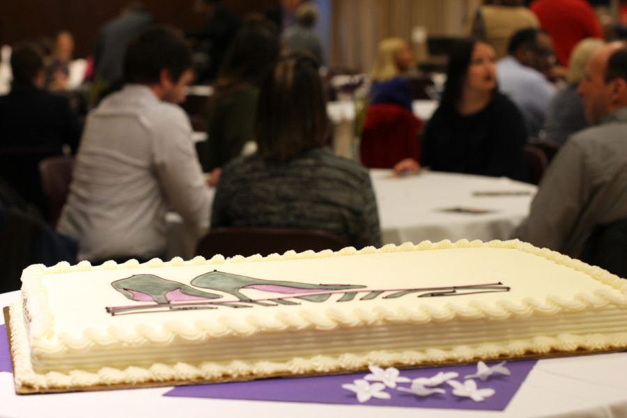 A cake sat at the entrance of the tribute of former dean of students, Pamela Anthony. A design of shoes covered the cake, which showed Anthony's love of shoes. The program was held in the Sun Room of the Memorial Union on March 28.