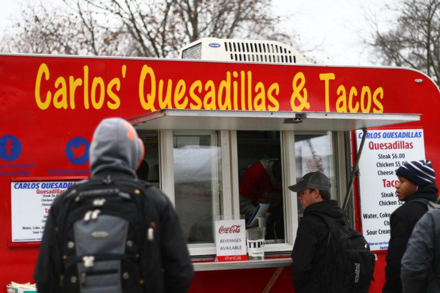 A student orders lunch at the Carlos Quesadillas and Tacos food truck outside Kildee Hall. Carlos Quesadillas has been in business for over ten years, and strives to purchase its ingredients from local, family-owned farms. 