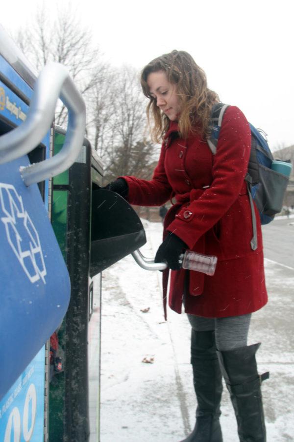 Krista Johnson,  senior in political science, utilizes the recycling compactors on campus, as well as the trash compactors available through out the university grounds.