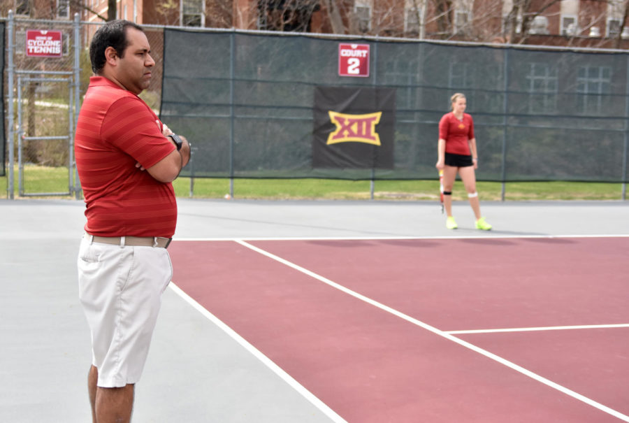 Iowa State head coach Armando Espinosa watches the Cyclones at their match against Kansas at the Forker Tennis Courts on April 10, 2016. ISU fell 4-2.