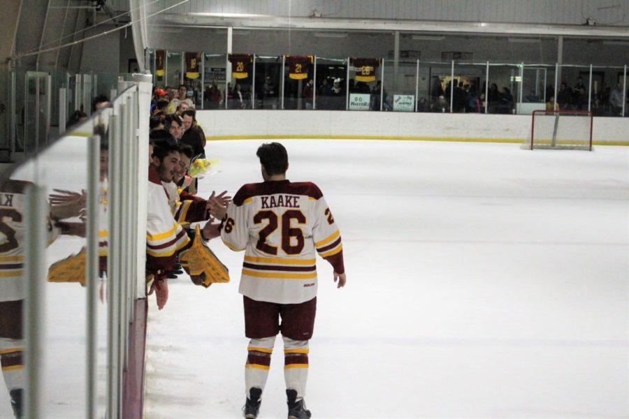 Senior Dalton Kaake celebrates his four years playing on the Cyclone Hockey team on Mar. 4. His friends and family where there to celebrate.