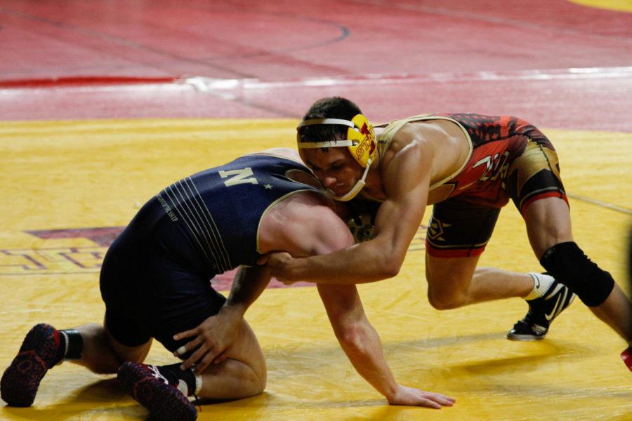 Iowa State freshman Kanen Storr wraps up his opponent during a match at the Harold Nichols Cyclone Open on Sunday, Nov. 13. 