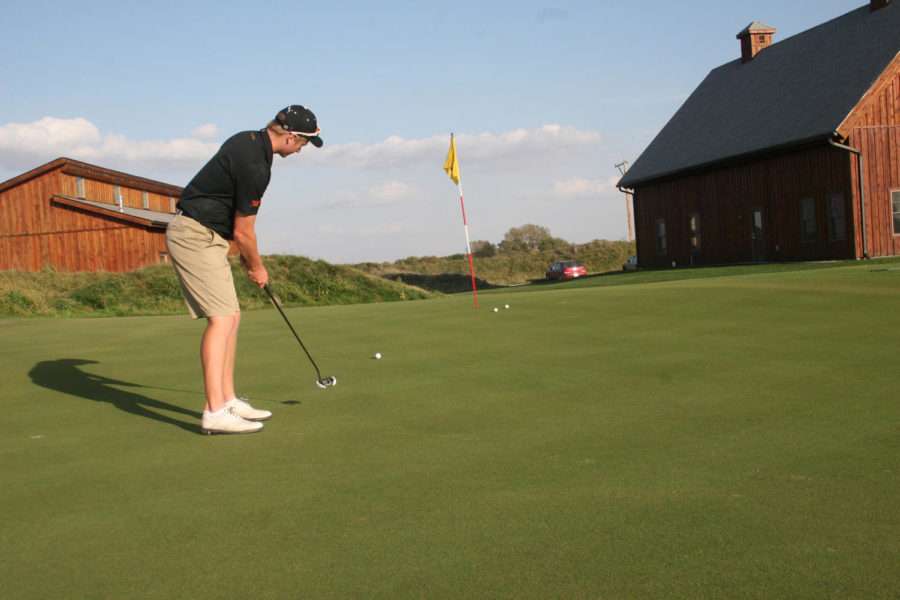 Junior Nick Voke practices his putting on the teams new putting green. The Iowa State golf team practiced on October 7th, 2015 at their new course.