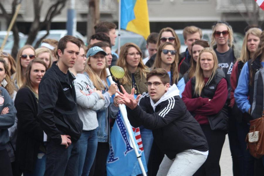 Greek members compete against each other in the balloon toss on Sunset Dr. in front of Phi Delta Theta.