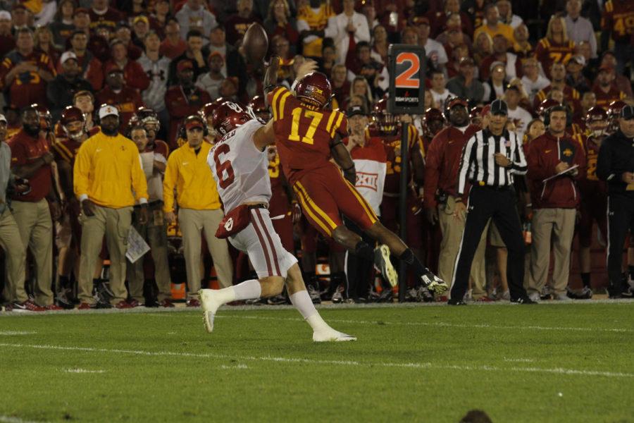Iowa State senior Jomal Wiltz dives at Oklahoma quarterback Baker Mayfield in the first half. Wiltzs hit caused the pass to pop up, and was then intercepted by Iowa State.