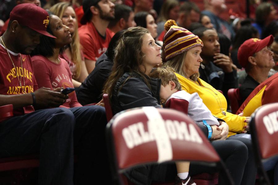 Katie Prohm, Iowa State coach Steve Prohms wife, sits with their son, Cass, during Iowa States game against Oklahoma at the Lloyd Noble Center in Norman, Oklahoma, on Jan. 21, 2017. Iowa State beat the Sooners 92-87 in double overtime.