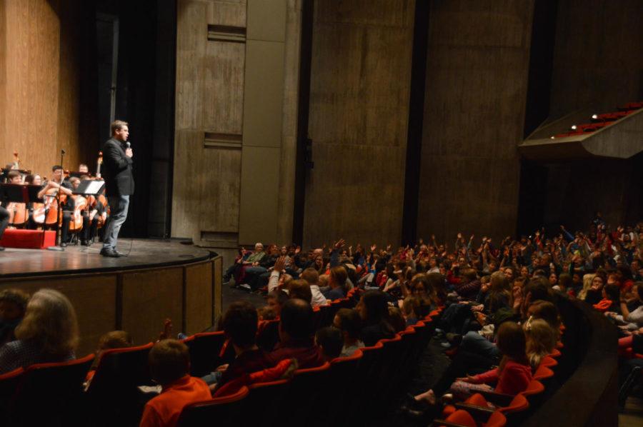 Iowa State University Symphony Orchestra Conductor Jacob Harrison interacts with the audience during the narrated program at Stephens Auditorium on Feb. 28. The program, part of the Childrens Matinee concert series, allowed young audiences to feel the excitement of a full symphony orchestra. 