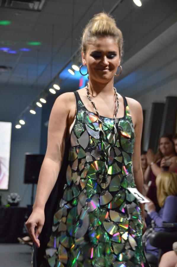 A+model+walks+down+the+runway+during+the+Trashion+Show+on+April+21.+Student+designers+created+garments+from+recycled+materials+to+raise+awareness+about+environmental+issues.%C2%A0
