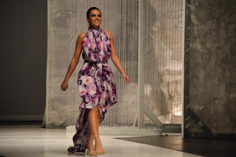 A model wearing Alex Peters ‘Reclaim the Earth’ design walks down the runway at Stephens Auditorium on April 8. The Fashion Show, which has been held annually for the past 35 years, is one of the largest student-run fashion shows in the nation.
