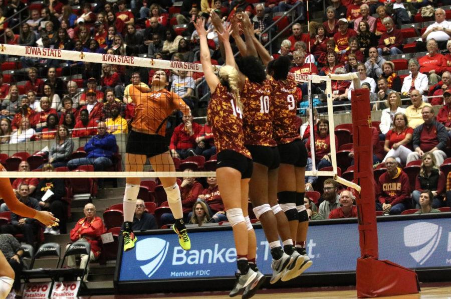 Jess Schaben, Grace Lazard and Samara West jump to block a hit from coming in. Iowa State went on to beat the Texas Longhorns 3-2 on Nov. 12.