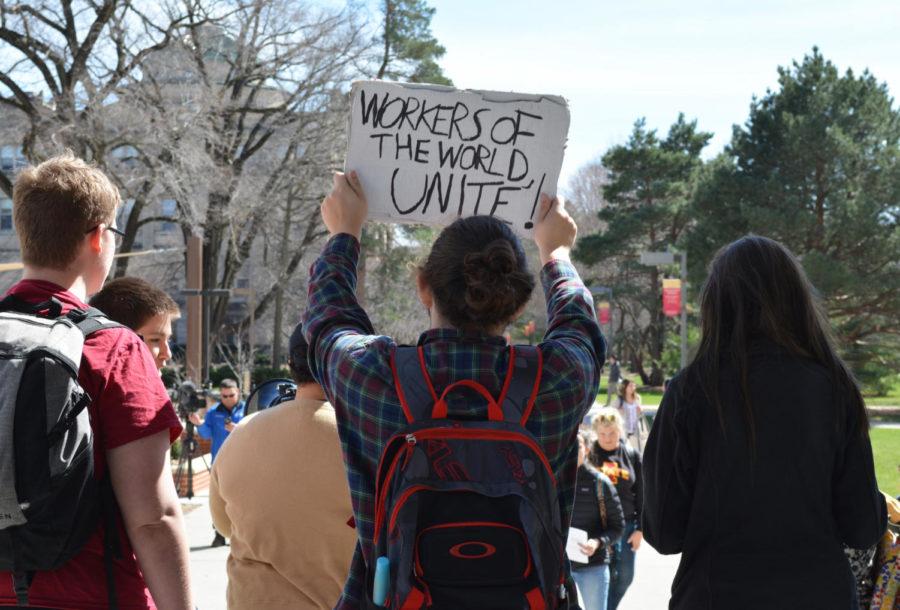 Mason+Mathes%2C+Iowa+State+student%2C+holds+up+a+sign+during+a+protest+against+prison+labor.+The+students+stood+outside+Parks+Library+to+protest+before+heading+to+Beardshear+Hall+on+Apr.+7.