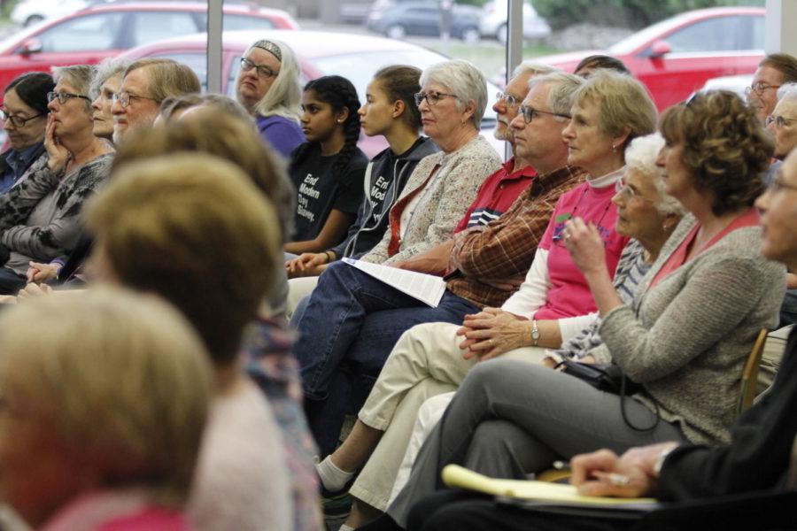 Members of the Ames community attend the Ames Interfaith Refugee event at the Ames public library.