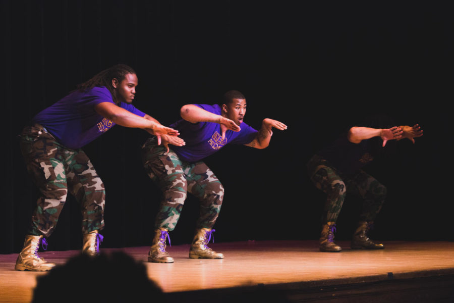 Members of Omega Psi Phi perform their recited step routine in front of a crowd of approximately 200 audience members in the Great Hall of the Memorial Union on Saturday evening.