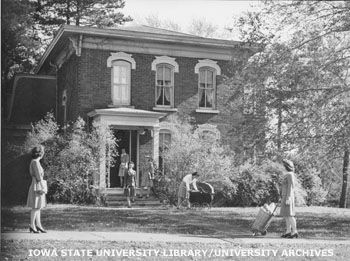 Sloss House, pictured in 1944. Students can be seen in period clothing standing around the building.