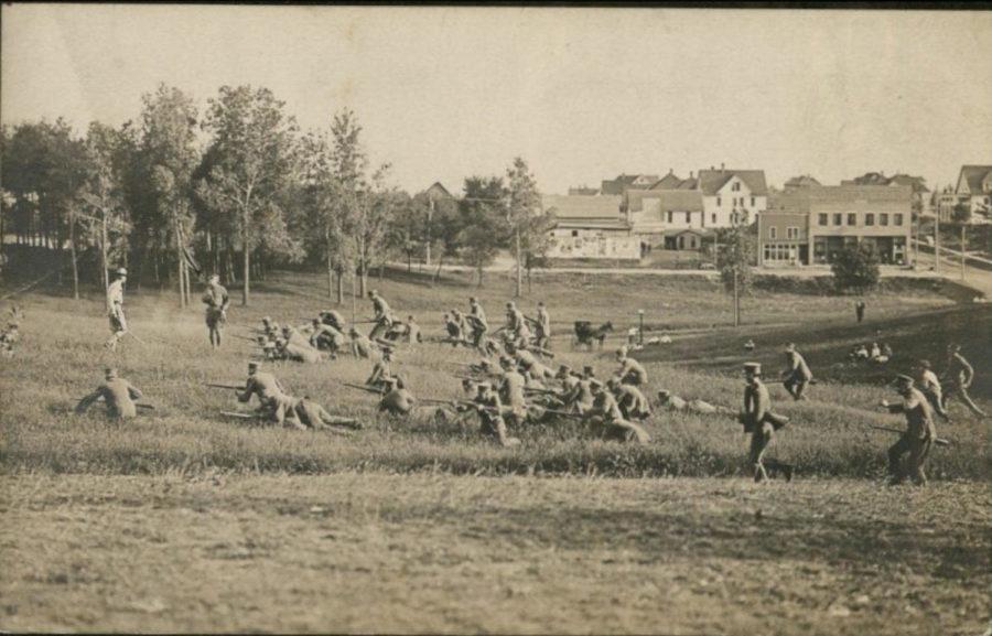 This postcard shows military training in the area that would become Lake Laverne. The back side reads Military drill at Ames. Commander James Rush Lincoln, a former Confederate, General with flag, in command. General Lincoln is at left side of picture in front of troops. Picture taken probably in 1912 or 1913.